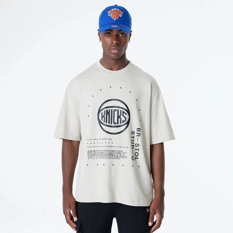 Men's long - sleeve henley t - shirts with button - down placketsMen's long - sleeve henley t - shirts with button - down placketsNew York Knicks Bristol Studio x NBA Light Beige Oversized T-Shirt